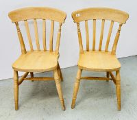 A PAIR OF WAXED PINE KITCHEN CHAIRS.
