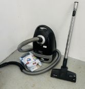 MIELE POWER PLUS 5000 VACUUM CLEANER, PLUS A BOX OF SPARE BAGS - SOLD AS SEEN.