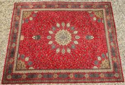 A EUROPEAN RUG IN PERSIAN STYLE, THE CENTRAL MEDALLION ON A RED FIELD, LENGTH 366CM.