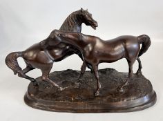 A BRONZE GROUP OF TWO HORSES ON AN OVAL NATURALISTIC BASE, AFTER P J MENE, L 48 X H 30CM.