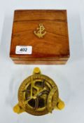 A REPRODUCTION BRASS COMPASS IN WOODEN BOX.