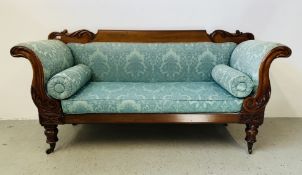 A MID VICTORIAN MAHOGANY SCROLL END SOFA WITH SIMPLY CARVED TOP RAIL AND ARM SUPPORTS,