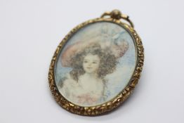 A FRENCH PORTRAIT OF A GIRL IN A PINK HAT IN DECORATIVE GILT METAL NARROW OVAL FRAME, H 5.5 X W 4.