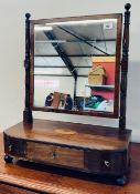 AN EARLY C19th MAHOGANY TOILET MIRROR, THE INLAID BASE ABOVE THREE DRAWERS, LATER PLATE, WIDTH 52CM.