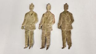 THREE WHITE METAL VOTIVES OF A MAN HOLDING HIS STOMACH.