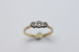 AN ELEGANT 3 STONE DIAMOND RING MARKED 18CT PLAT.