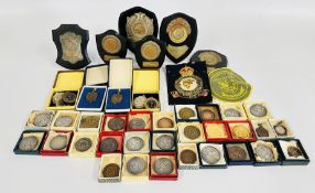 A GROUP OF ASSORTED ATHLETIC MEDALS AND MEDALLIONS.