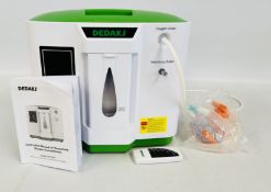 DEDAKJ HOUSEHOLD OXYGEN CONCENTRATOR WITH INSTRUCTIONS AND REMOTE, MODEL: DE-2AW - SOLD AS SEEN.