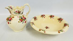 A MODERN CERAMIC WASH JUG AND BOWL DECORATED WITH ROSES.