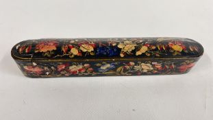 A PERSIAN QUJAR PERIOD LACQUERED PAPER MACHE PEN BOX.