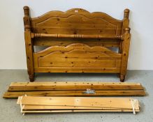 A SOLID PINE DOUBLE BEDSTEAD.