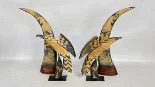 A PAIR OF MOUNTED HORNS, INTRICATELY CARVED WITH DRAGONS AND TIGERS,