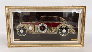 A DECORATIVE WALL CLOCK FEATURING A VINTAGE CAR SILHOUETTE CREATED FROM WATCH PARTS BEARING 
