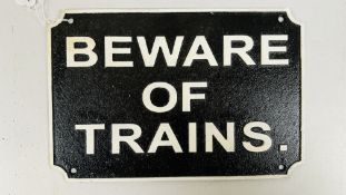 (R) BEWARE OF TRAINS SIGN.