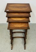 A NEST OF 4 REPRODUCTION MAHOGANY TABLES.