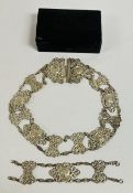AN ELABORATE ANTIQUE SILVER OPEN WORK BELT DECORATED WITH CHERUBS, NO VISIBLE MAKERS MARK,