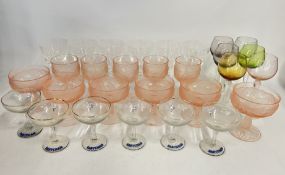 A HARLEQUIN SET OF SIX COLOURED GLASS HOCKS,