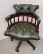 A BOTTLE GREEN LEATHER CAPTAINS STYLE BUTTON BACK REVOLVING OFFICE CHAIR - TRADE SALE ONLY.