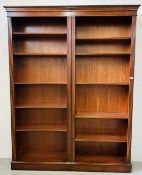 AN IMPRESSIVE REPRODUCTION TWO SECTION MAHOGANY FINISH BOOKCASE.