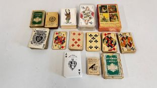 A GROUP OF VARIOUS VINTAGE PLAYING CARDS AND GAMES.