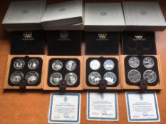 COINS: CANADA OLYMPIC SILVER PROOF SETS 1973, 74, 75 AND 76, EACH IN CASE WITH BOX,