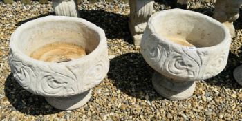 A PAIR OF STONEWORK PEDESTAL PLANTERS WITH SCROLLED DECORATION.