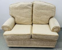 MODERN CREAM TWO SEATER SOFA.