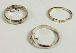 TWO SILVER HINGED ENGRAVED BANGLES WITH SAFETY CHAINS + TWO FURTHER SILVER CHRISTENING STYLE