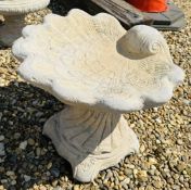 A STONEWORK SHELL DESIGN BIRD BATH, HEIGHT 39CM.