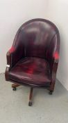 AN OXBLOOD LEATHER REVOLVING OFFICE CHAIR WITH STUDDED DETAIL - TRADE SALE ONLY.