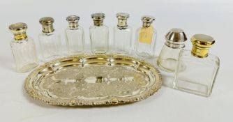 A GROUP OF 8 VINTAGE SILVER AND WHITE METAL TOPPED DRESSING TABLE BOTTLES, VARIOUS DATES AND MAKERS.