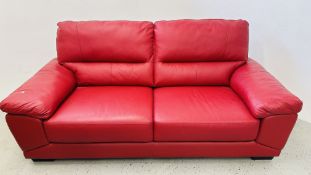A MODERN DESIGNER TWO SEATER RED LEATHER SOFA.