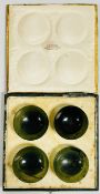 A SET OF 4 ANTIQUE POLISHED HARDSTONE TEA BOWLS PRESENTED IN A VINTAGE CASE MARKED H.