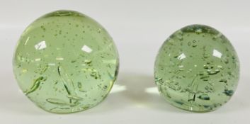 A GRADUATED SET OF TWO ANTIQUE GREEN GLASS DUMP PAPERWEIGHTS, H 14CM & H 12CM.