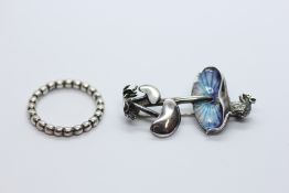 A SILVER PANDORA RING IN ORIGINAL BOX AND A SILVER AND ENAMEL TOADSTOOL BROOCH.