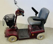 A SHOPRIDER MOBILITY SCOOTER WITH CHARGER.