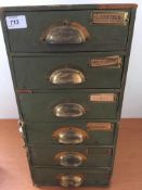 STAMPS: VINTAGE SIX DRAWER CABINET WITH AN OLD TIME BALANCE OF A COLLECTION IN PACKETS,