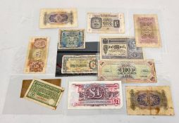 A GROUP OF WWII BANK NOTES.
