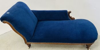 ANTIQUE MAHOGANY FRAMED CHAISE LOUNGE WITH BLUE VELVET UPHOLSTERY.