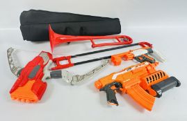 3 ASSORTED NERF GUNS + A TROMBONE.