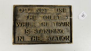 (R) CAST TOILET SIGN.