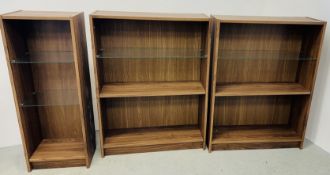 A PAIR OF MODERN OAK FINISH 3 TIER BOOKSHELVES WITH TOP GLASS SHELF + ONE FURTHER NARROWER EXAMPLE.