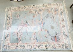 A MODERN CHINESE DEEP PILE WOOL CARPET DECORATED WITH CHINESE PAGODA'S AND TEMPLES ON A GREEN