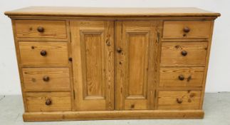VINTAGE PINE 8 DRAWER KITCHEN SIDEBOARD WITH CENTRAL TWO DOOR CUPBOARD.