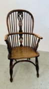AN ANTIQUE STICK BACK WINDSOR STYLE CHAIR WITH SHAPED ELM SEAT AND CRINOLINE STRETCHER.