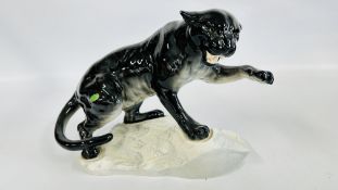 A BESWICK MODEL OF A BLADE LEOPARD 1702 BEARING ORIGINAL STICKER.