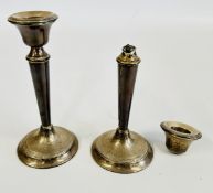 A PAIR OF SILVER CANDLESTICKS (ONE DAMAGED AND BROKEN), LONDON ASSAY (FILLED).