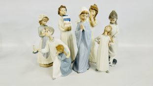 A GROUP OF 7 ASSORTED LLADRO & NAO FIGURES TO INCLUDE CHILDREN IN CLASSIC BEDROOM ATTIRE.