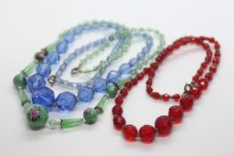A GROUP OF 3 VINTAGE GLASS BEADED NECKLACES.