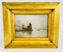 A GILT FRAMED OIL ON BOARD DEPICTING RIVERSIDE DOCKS BEARING MONOGRAM R.C.
